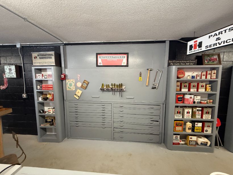 Dealer parts and service wall with cabinets, tools, and IH signage